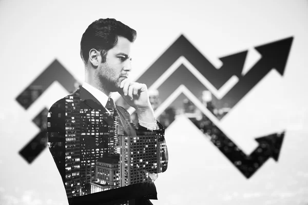 Thoughtful businessperson in suit on creative city background with chart arrows. Success concept. Double exposure. Black and white image — Stock Photo, Image