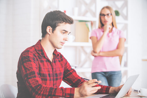 Young businessman using laptop