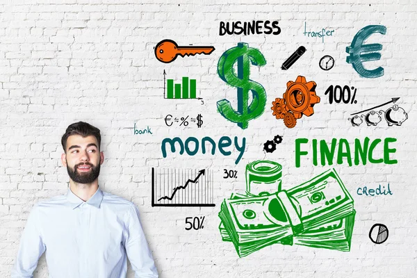 Porträtt av attraktiva kaukasiska kille på tegel bakgrund med färgglada finansiella skiss. Finance koncept — Stockfoto