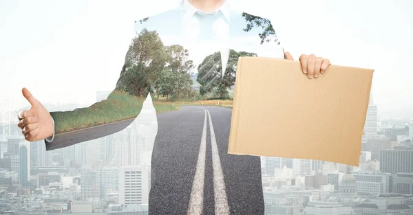 Businessman with cardboard poster — Stock Photo, Image