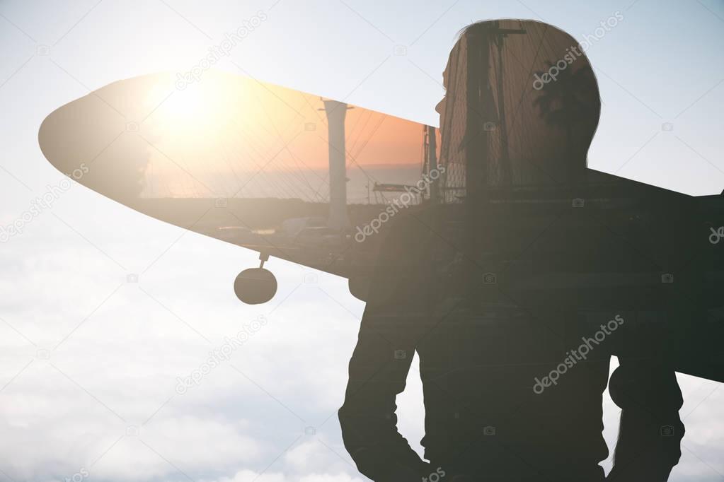 Woman and airplane silhouettes on city and sky background with sunlilght. Vacation concept. Double exposure