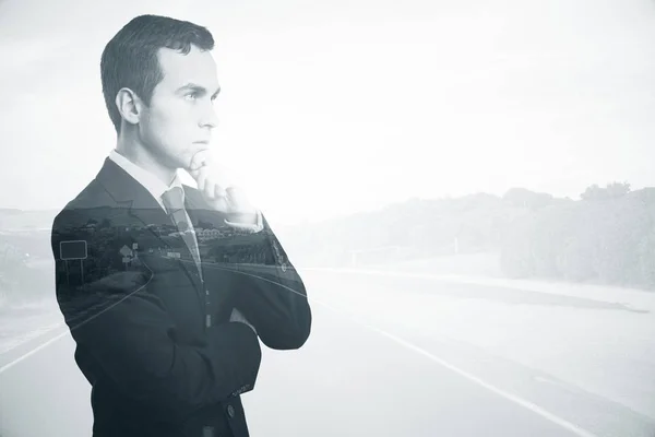 Side portrait of thoughtful young businessman on road background. Decisions concept. Double exposure — Stock Photo, Image