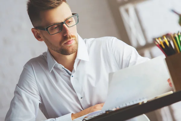 Attractive man with document — Stock Photo, Image