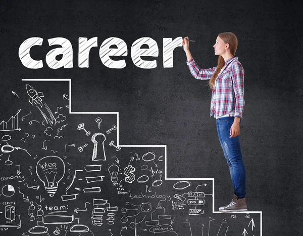 Side view of attractive young woman standing on abstract drawn ladder and writing on dark background. Career concept — Stock Photo, Image