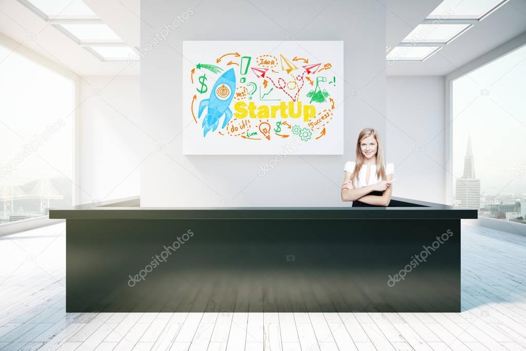 Young woman at reception desk