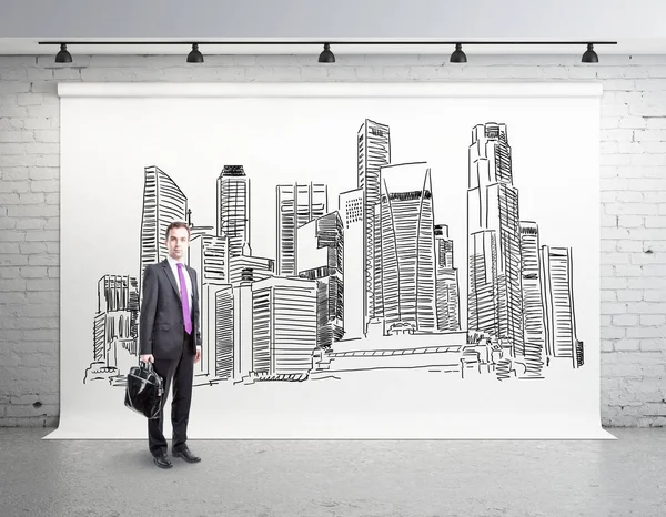 Man in room with city sketch — Stock Photo, Image