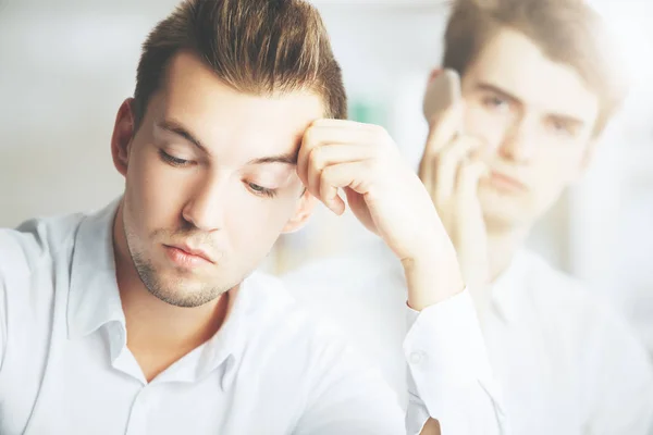 Attractive businessmen talking on phone — Stock Photo, Image