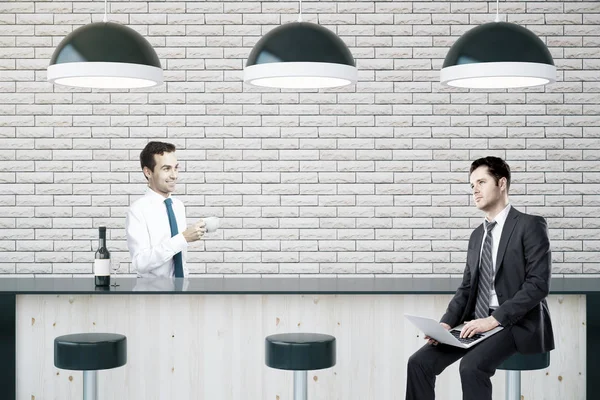 Two businessmen sitting at bar — Stock Photo, Image