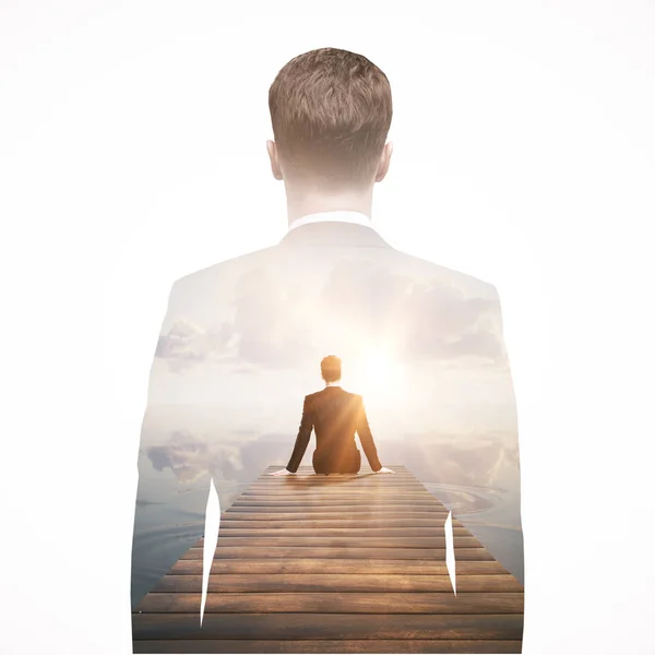 Back view of thoughtful businessman sitting on pier and looking into the distance. Research concept. Double exposure — Stock Photo, Image