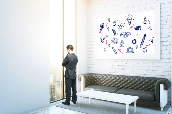 Gentile uomo d'affari in interni con vista sulla città, divano in pelle, tavolino da caffè e icone dell'educazione in cornice. Concetto di conoscenza. Rendering 3D — Foto Stock