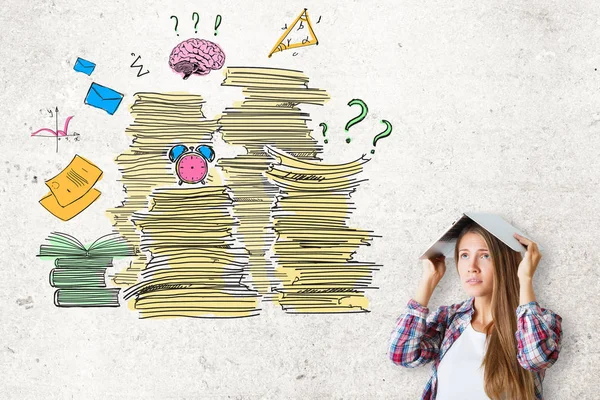 Tired young woman with laptop on head standing on concrete background with abstract drawing of paperwork stacks other items. Job duties and stress concept — Stock Photo, Image