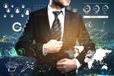 Gece şehir arka planda iş Çizelgeler ve grafikler ile işadamı. Çift pozlama. İstihdam kavramı