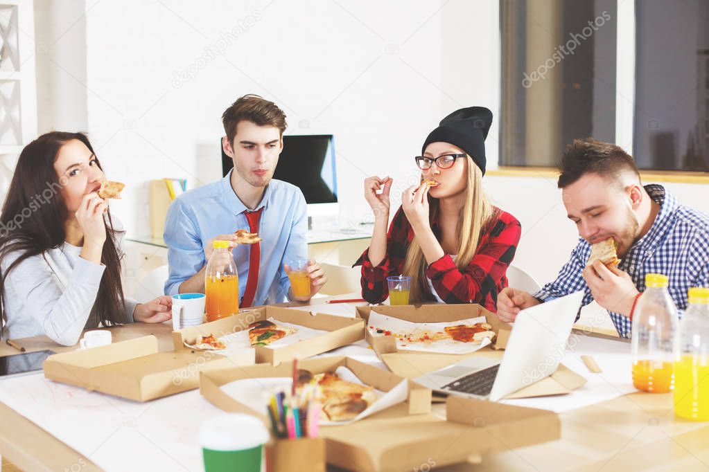 European people eating at workplace