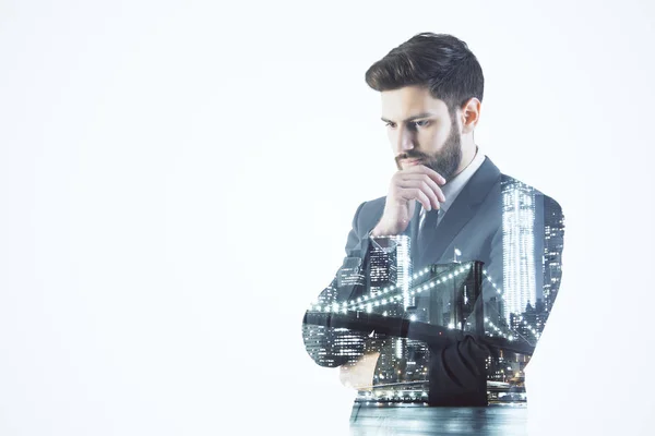 Handsome thoughtful businessman on night city background with white copy space. Employment concept. Double exposure — Stock Photo, Image