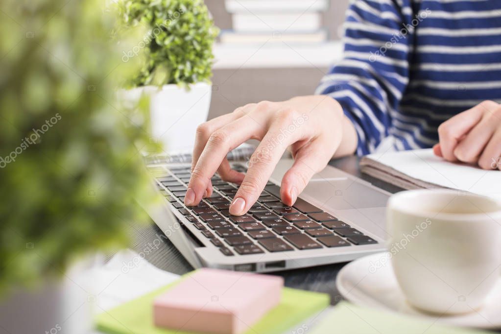 Female using laptop closeup