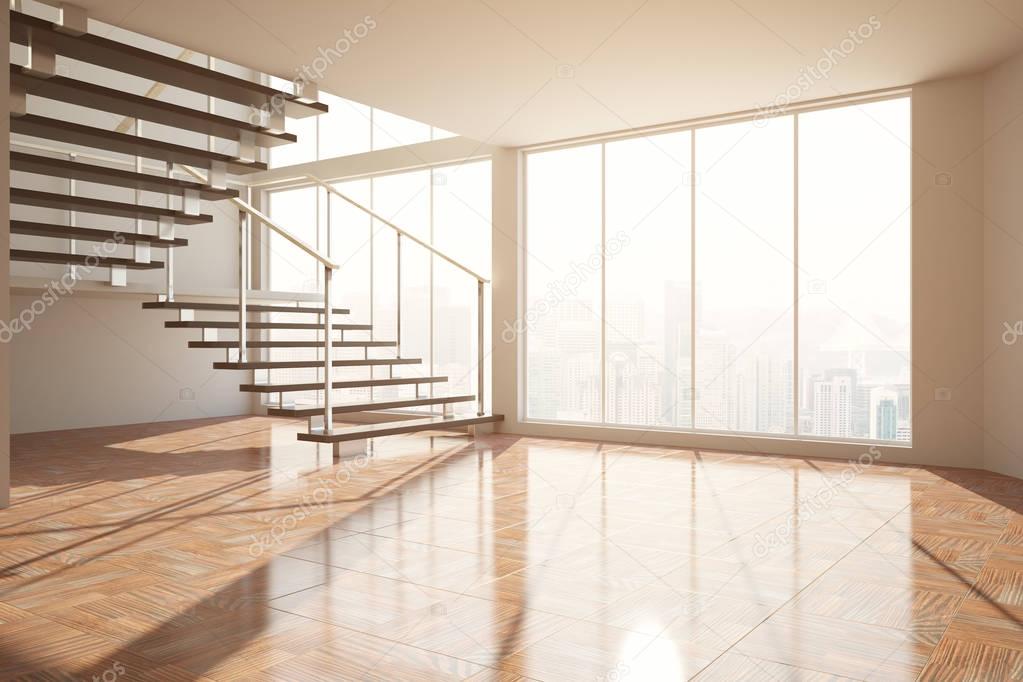 Empty room with stairs and sunlight