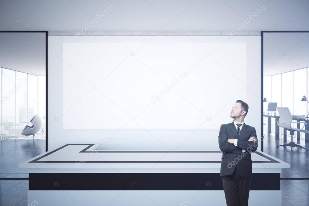 Man at reception with billboard