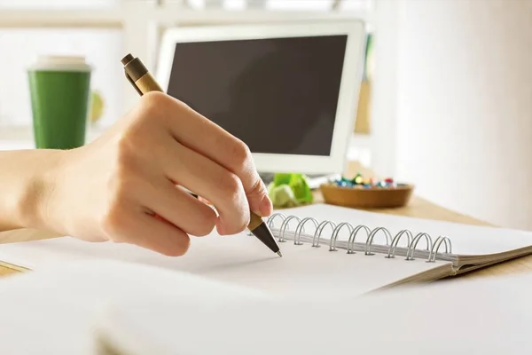 Businesswoman writing in notepad — Stock Photo, Image