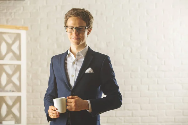 Handsome businessman with coffee cup — Stock Photo, Image