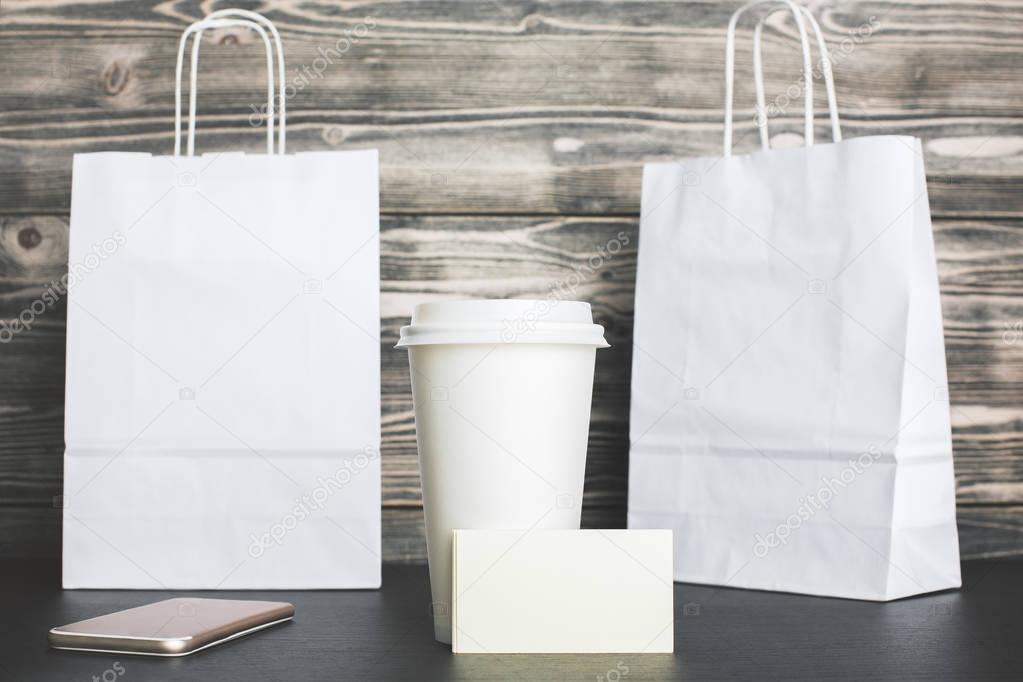 Blank shopping bags and coffee closeup