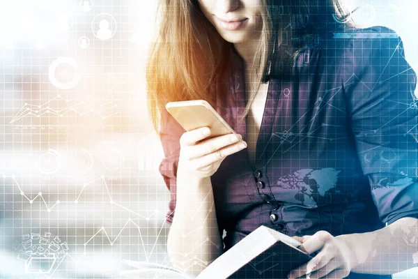 Young woman using smartphone and holding book on blurry background with business pattern — Stock Photo, Image