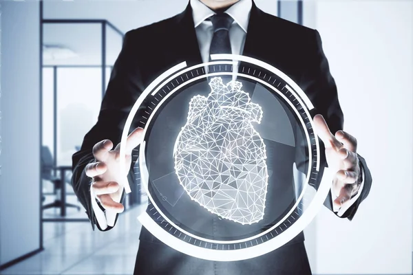 Businessman holding abstract digital circle with polygonal heart in interior. Cardiology concept. — Stock Photo, Image