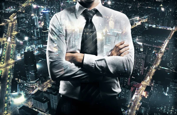 Businessman with folded arms on night city background. Research concept. Double exposure — Stock Photo, Image
