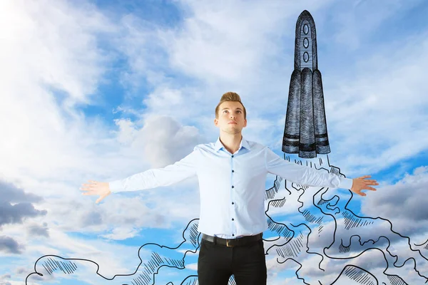 Young businessman flying on sky background with drawn space ship. Rocketing concept — Stock Photo, Image