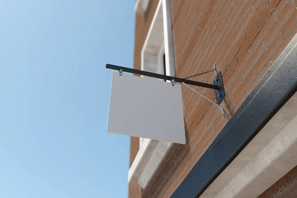 Rolha sqare vazia pendurada no edifício de tijolos vermelhos. Fundo azul do céu. Conceito de publicidade. Renderização 3D — Fotografia de Stock