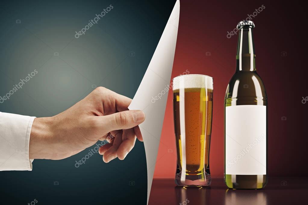 Hand flipping abstract page, revealing empty beer bottle and glass on red background. Drink advertising and packaging concept. Mock up, 3D Rendering