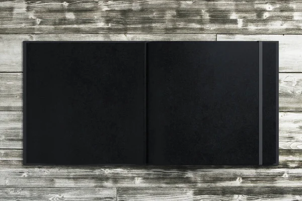 Copybook nero vuoto su desktop in legno — Foto Stock