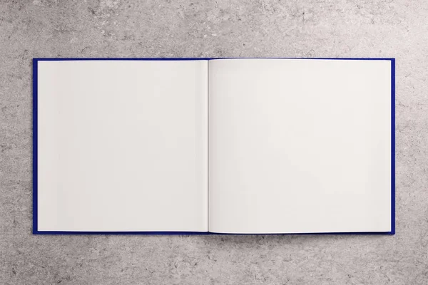 Bloc de notas blanco en blanco sobre superficie de hormigón —  Fotos de Stock