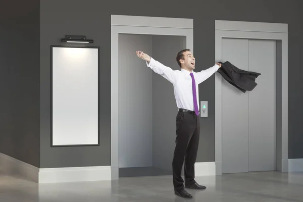 Successful man in room with lift — Stock Photo, Image