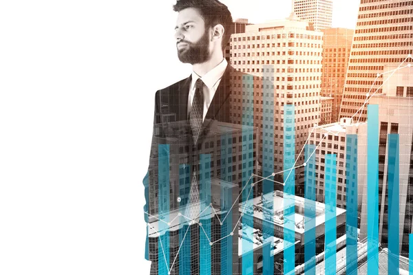 Handsome young businessman standing on city background with business chart bars and copy space. Economy concept. Double exposure — Stock Photo, Image