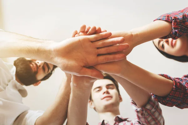 Bottom view of hands on top of each other. Partnership concept — Stock Photo, Image