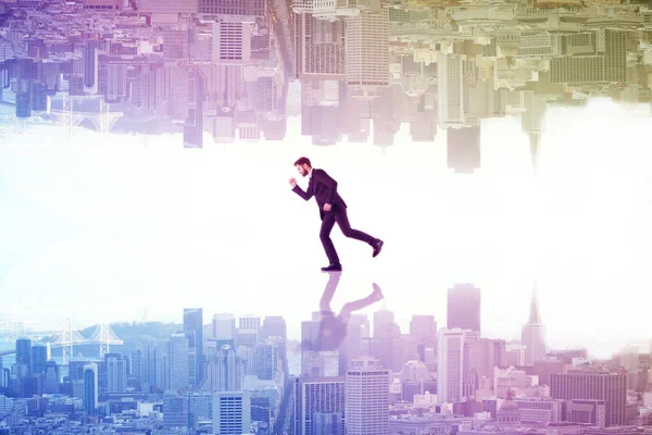 Running businessman with reflection on abstract upside down rainbow city background. Lifestyle concept