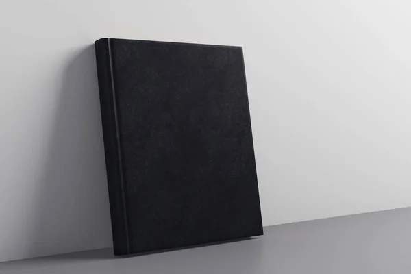 Empty closed black hardcover notepad leaning on concrete wall. Advertising concept. Mock up, 3D Rendering — Stock Photo, Image