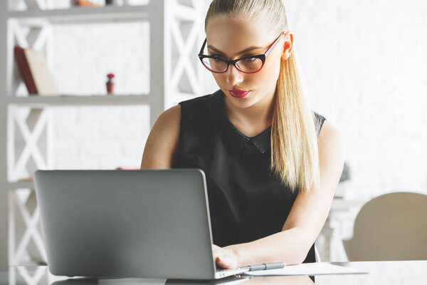 Attractive businesswoman working on project 