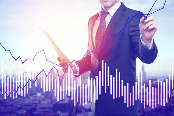 Unrecognizable businessman with document in hand drawing abstract business graph on blurry city background. Economy concept. Double epxosure — Stock Photo, Image