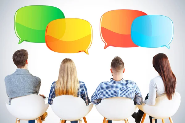 Back view of people with speech bubbles — Stock Photo, Image