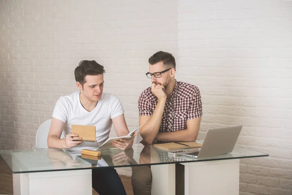 Attractive men working on project