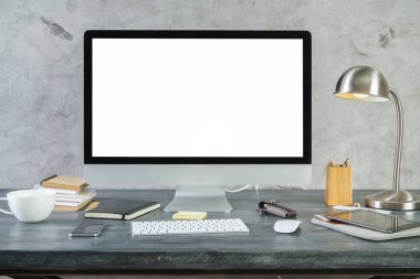 Desk with empty white pc monitor front
