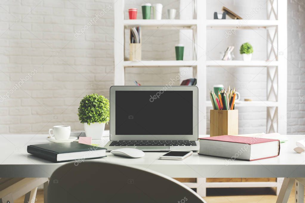 Desktop with white laptop screen