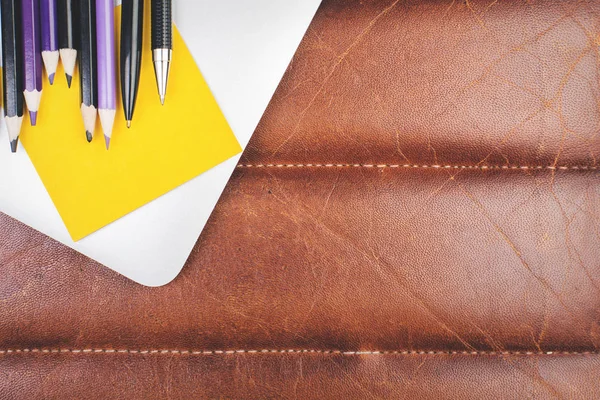 Leather desk with supplies — Stock Photo, Image