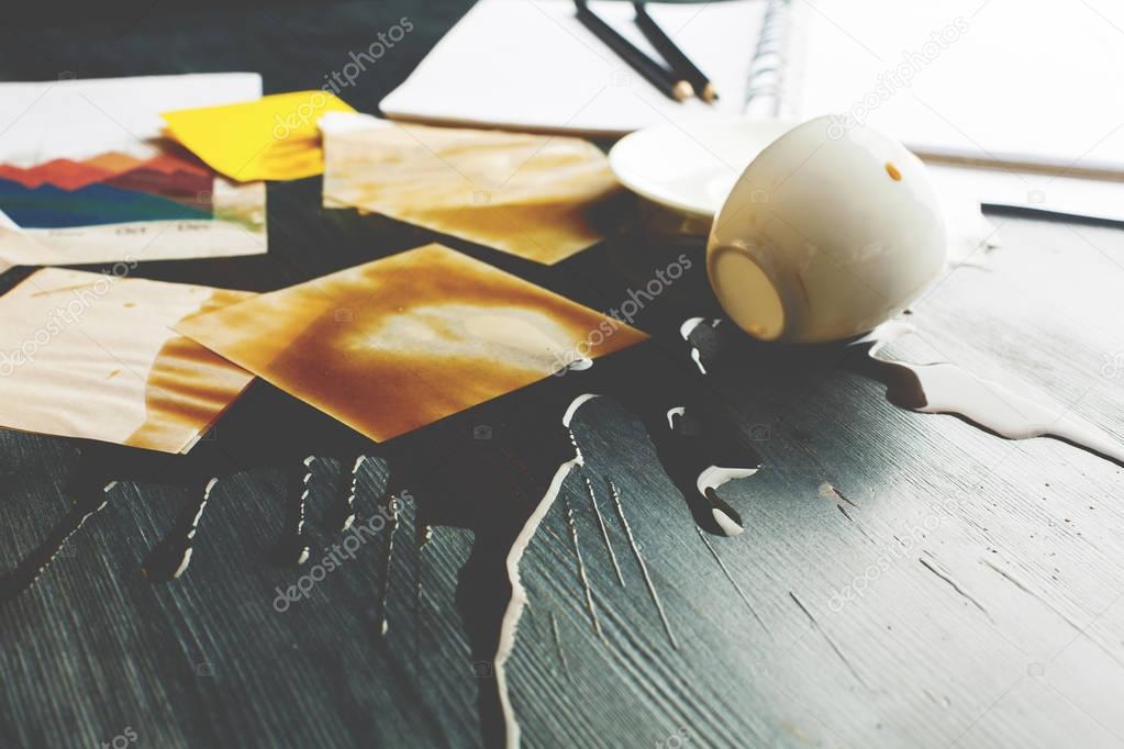 Office desk with spilt coffee closeup