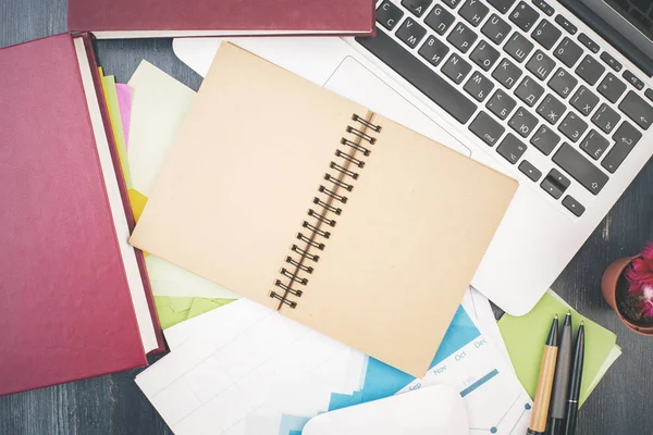 Creative table with empty notepad — Stock Photo, Image