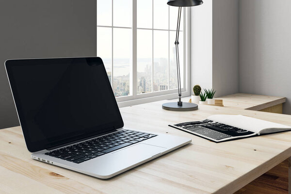 Modern workplace with laptop side