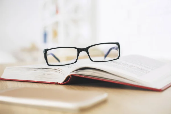 Glasses, book and smartphone — Stock Photo, Image