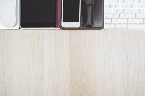 Light desk top with devices and supplies