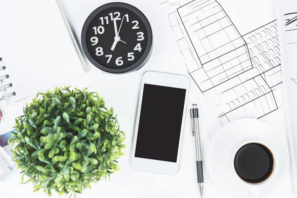 White office desk top with smarphone — Stock Photo, Image